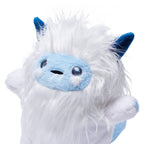 An AI interactive yeti toy with fluffy white fur, a light blue face, and dark blue pointed ears, photographed against a clean white background.